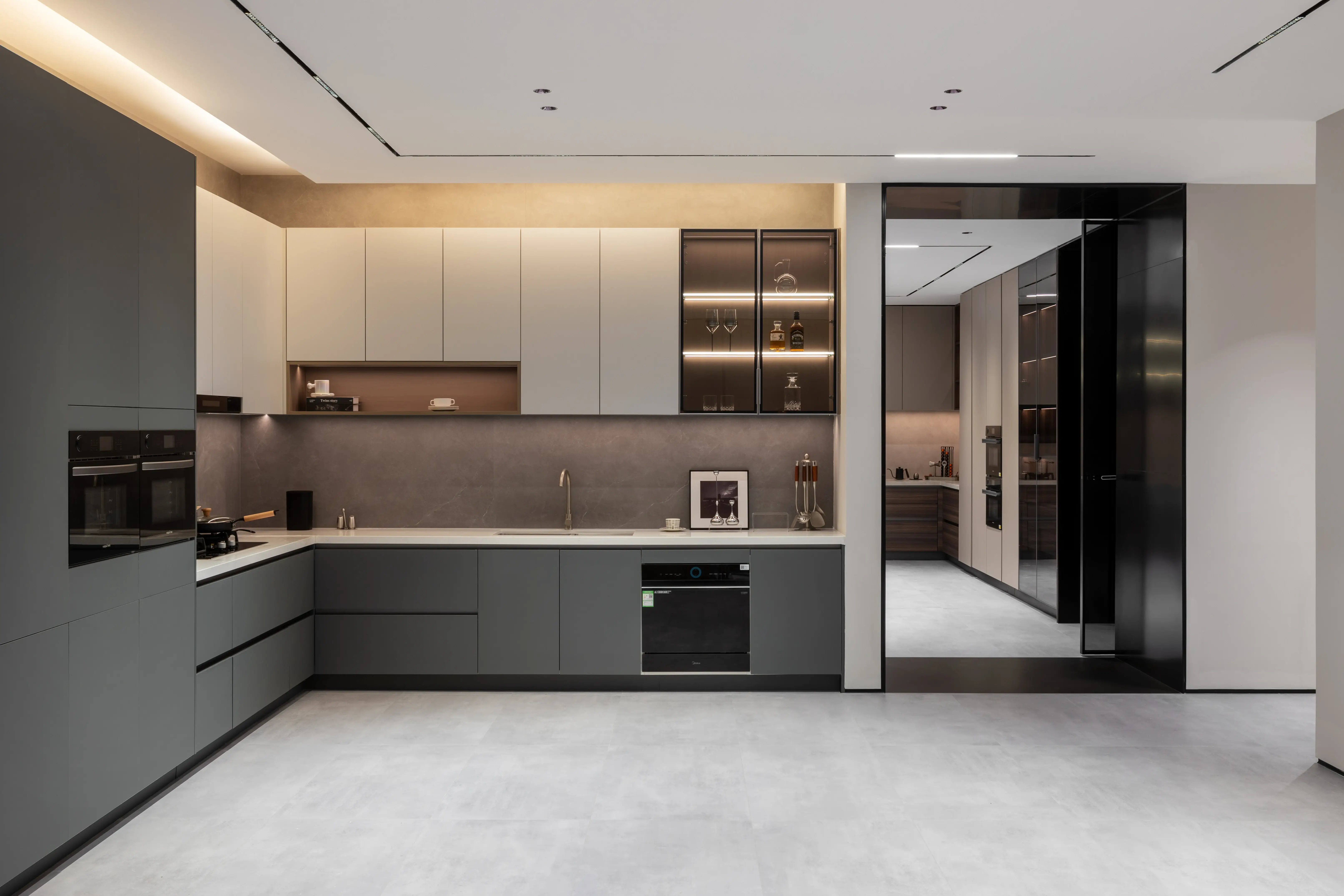 Two-tone grey and white kitchen with a wide open floor
